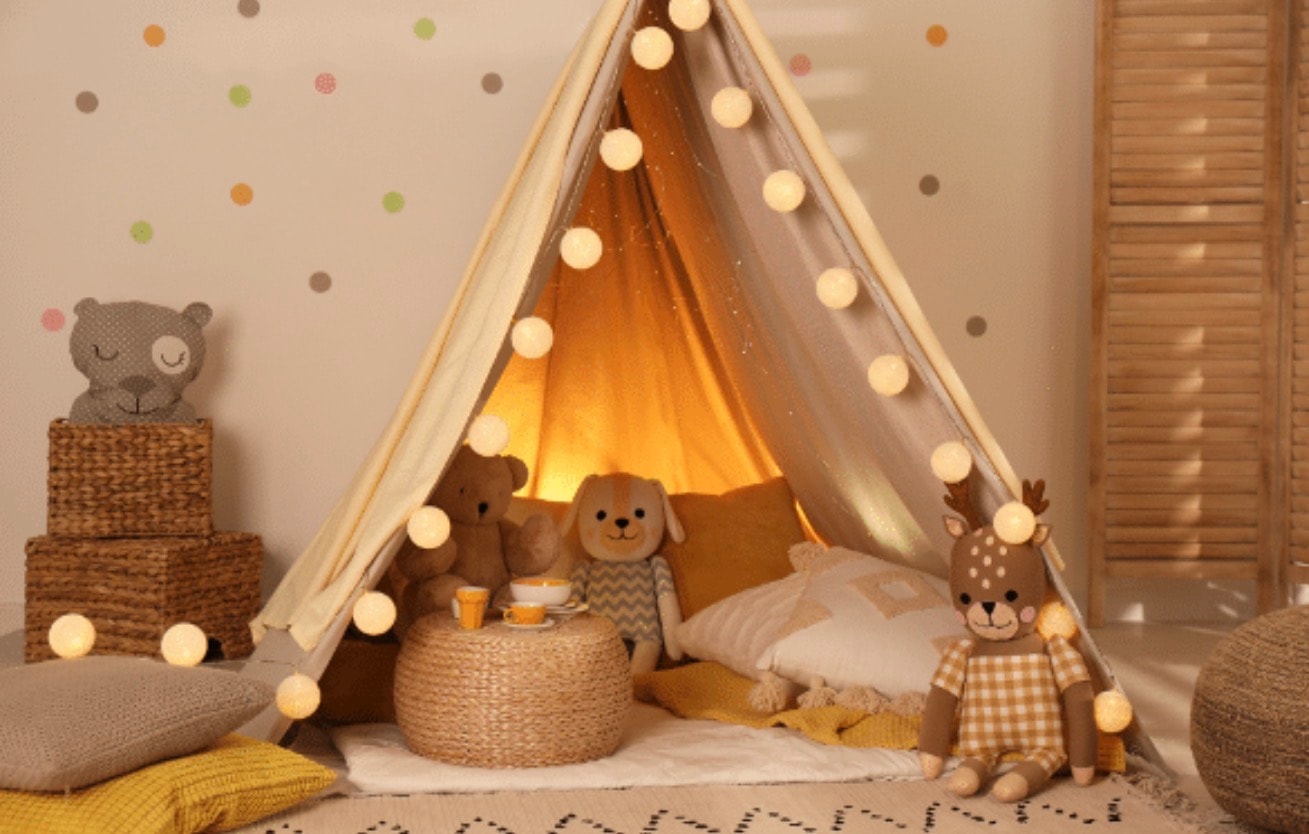 Cozy calm-down corner with a warm teepee, soft lighting, and stuffed animals